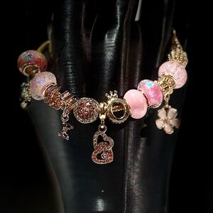 Elegant Pink and Gold Charm Bracelet